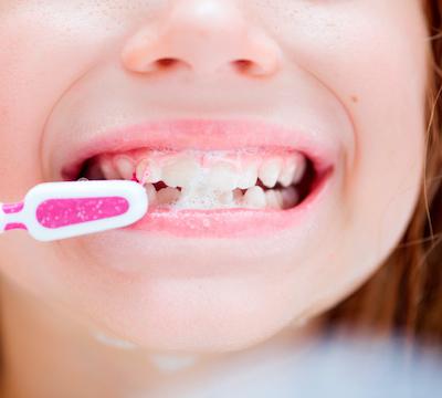 child brushing their teeth