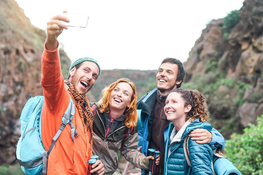 Friends taking a selfie while out on a hike