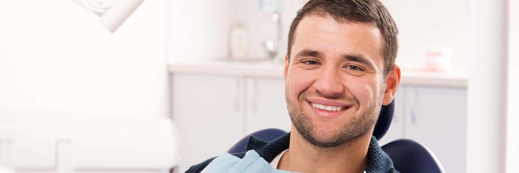 sandpoint man smiling in dental chair at North Idaho Dental Group
