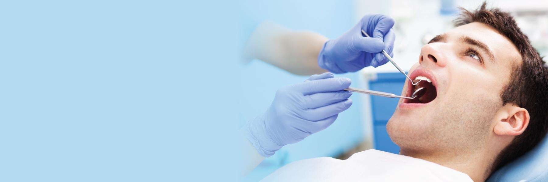 man getting a thorough exam at a coeur d'alene dental office