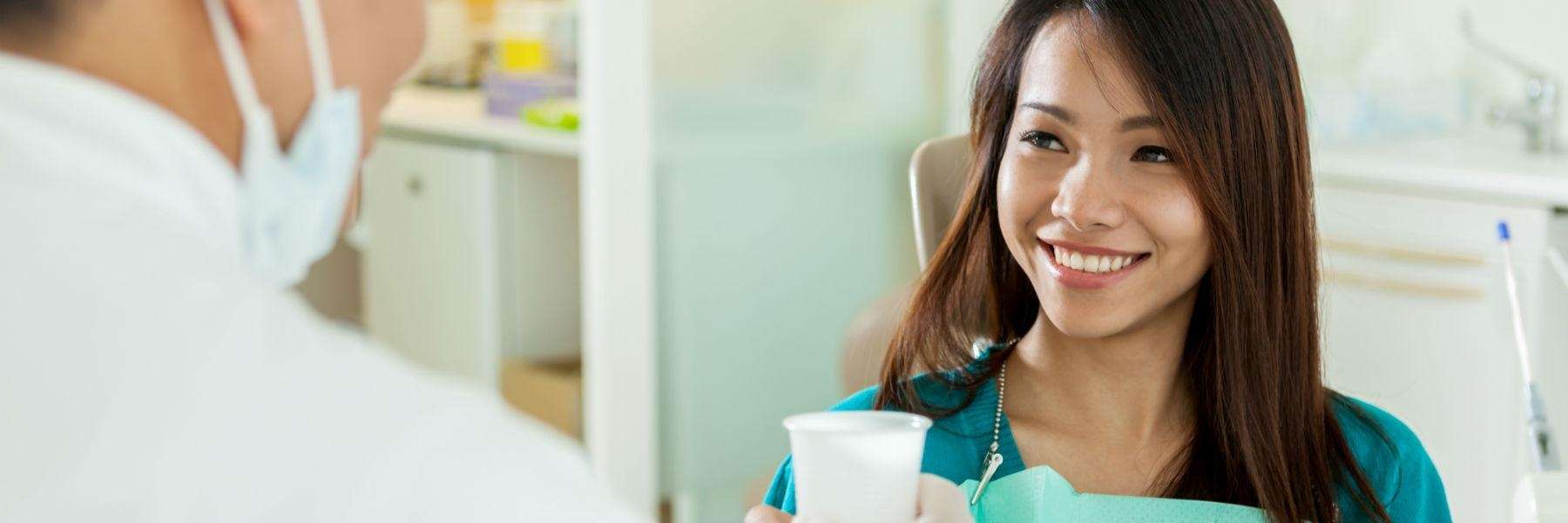 woman smiling after getting emergency dental care in Sandpoint