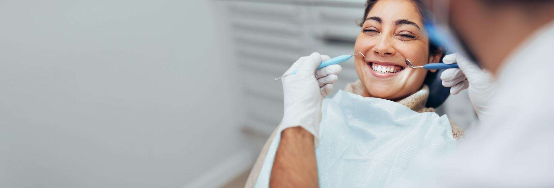 woman smiling after getting gum treatment in sandpoint