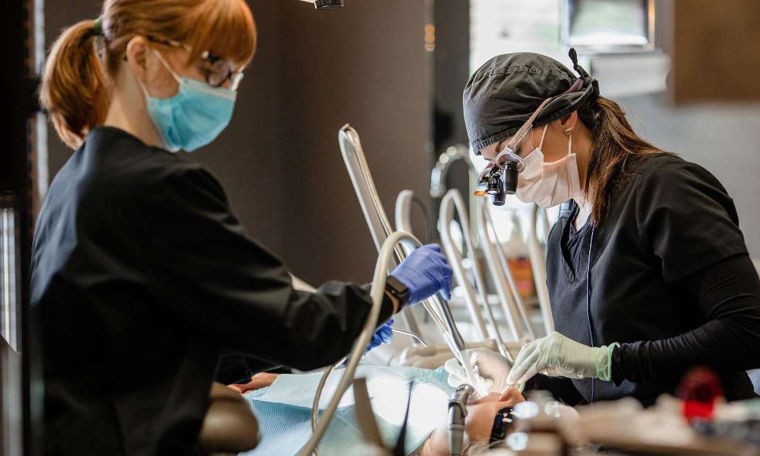 dentist and hygienist working on patient in Coeur d'Alene