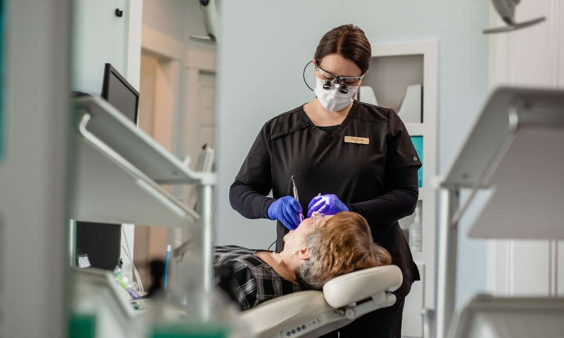 Hygienist Working on Patient around Sandpoint